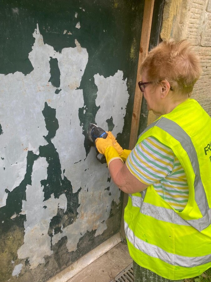 Stripping a door in preparation for painting 